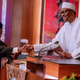 Nigeria’s president Buhari swears in Tanko Mohammed as the acting Chief Justice in Abuja